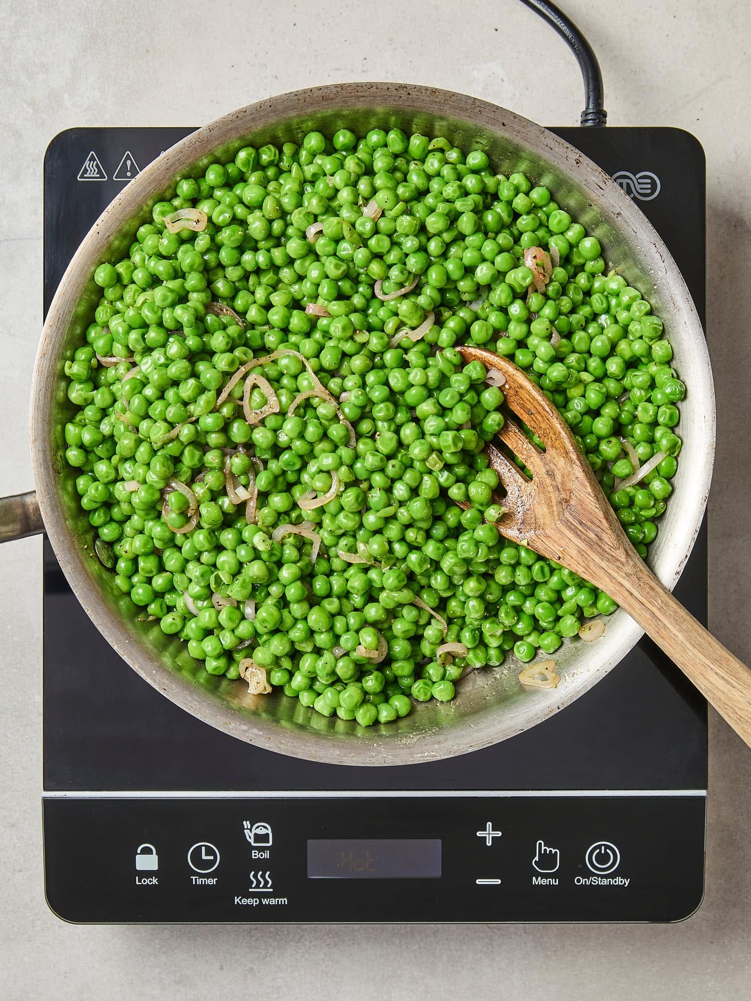 Peas added to skillet with vinaigrette.