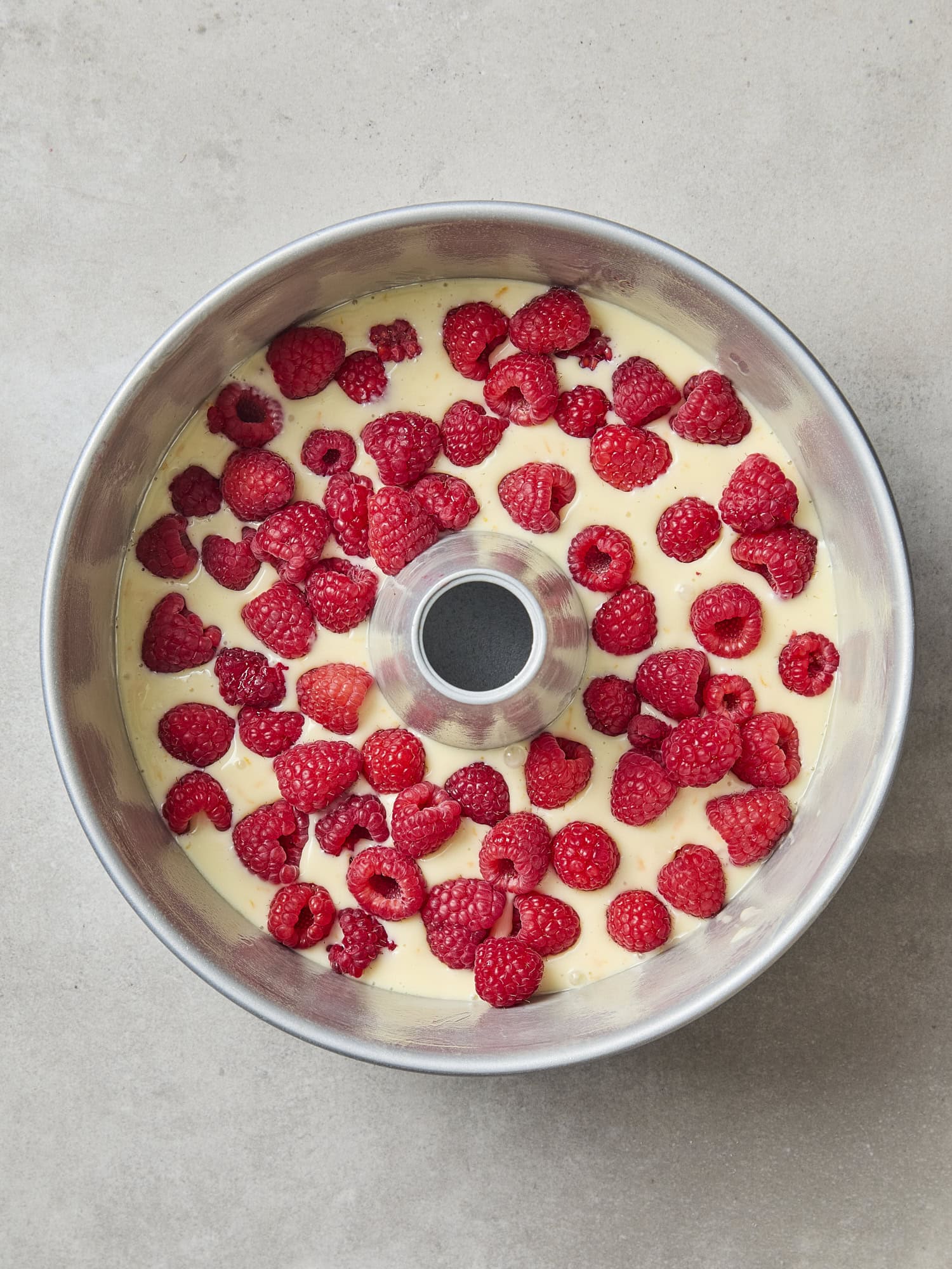 Raspberries and cream cheese for layer of coffee cake.