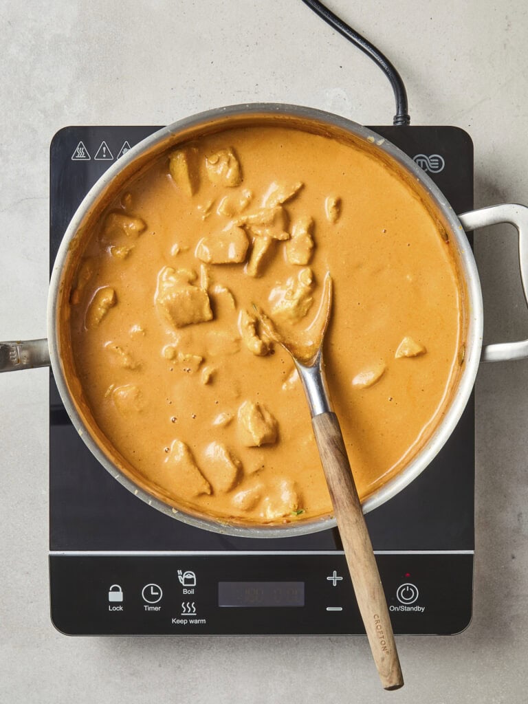 Butter chicken in saucepan after simmering.