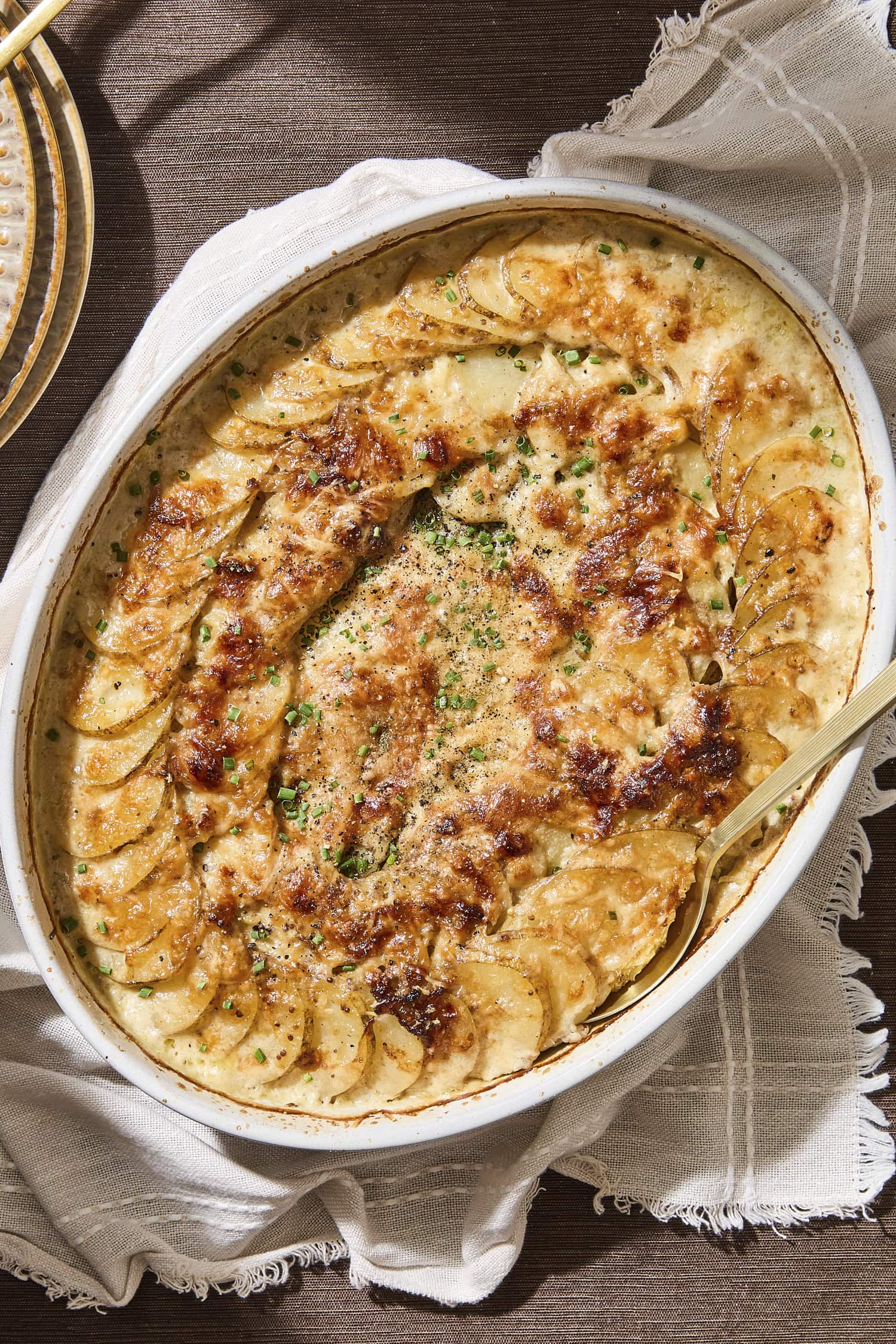 Baking dish with homemade scalloped potatoes.