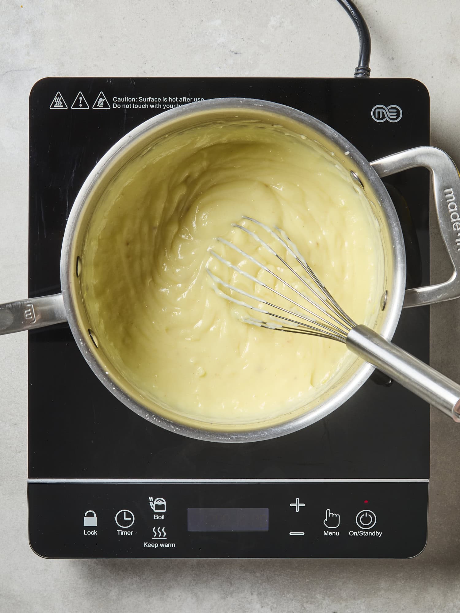 Lemon pudding mixture cooking.