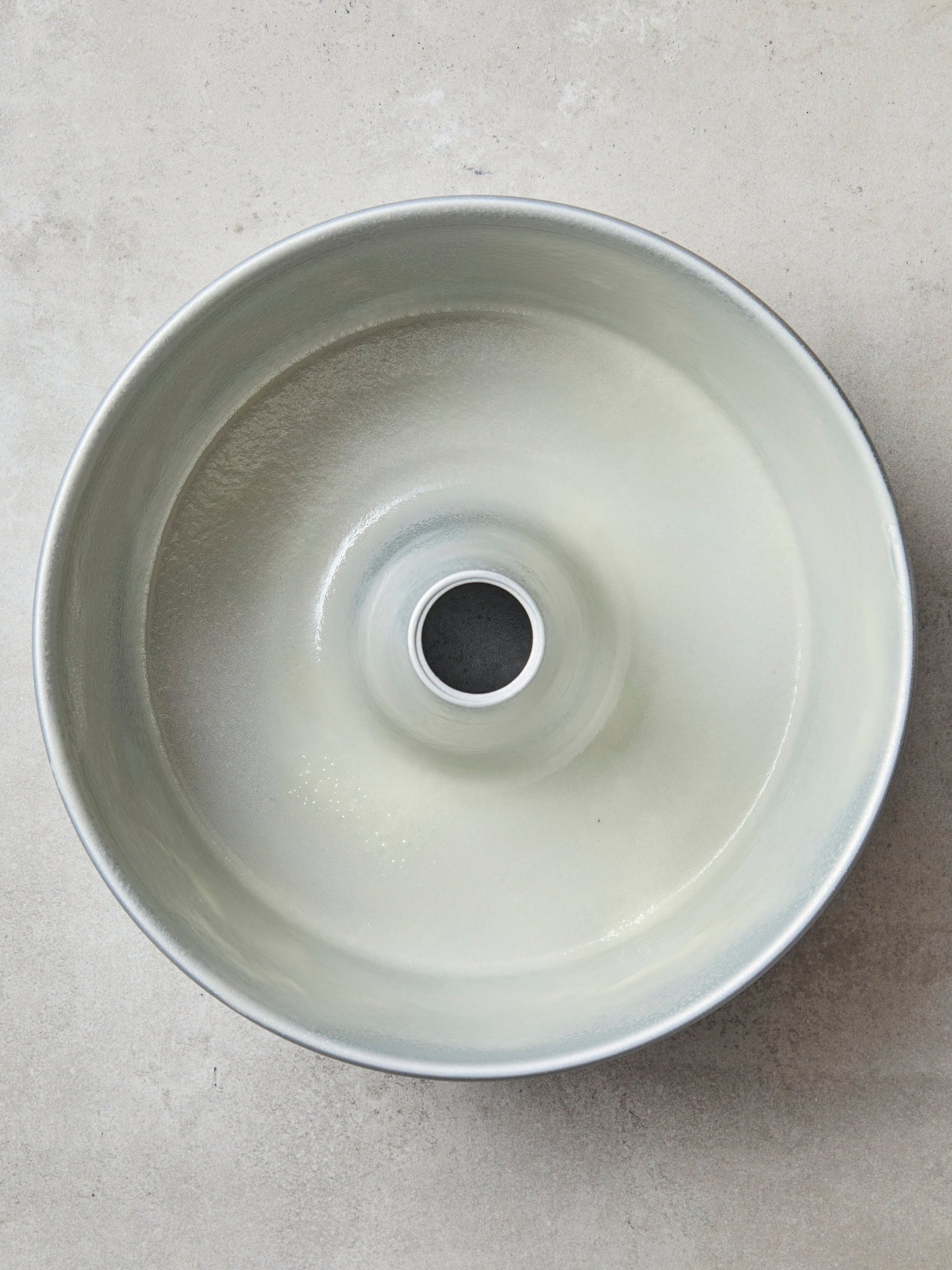 Prepared metal baking pan for coffee cake.