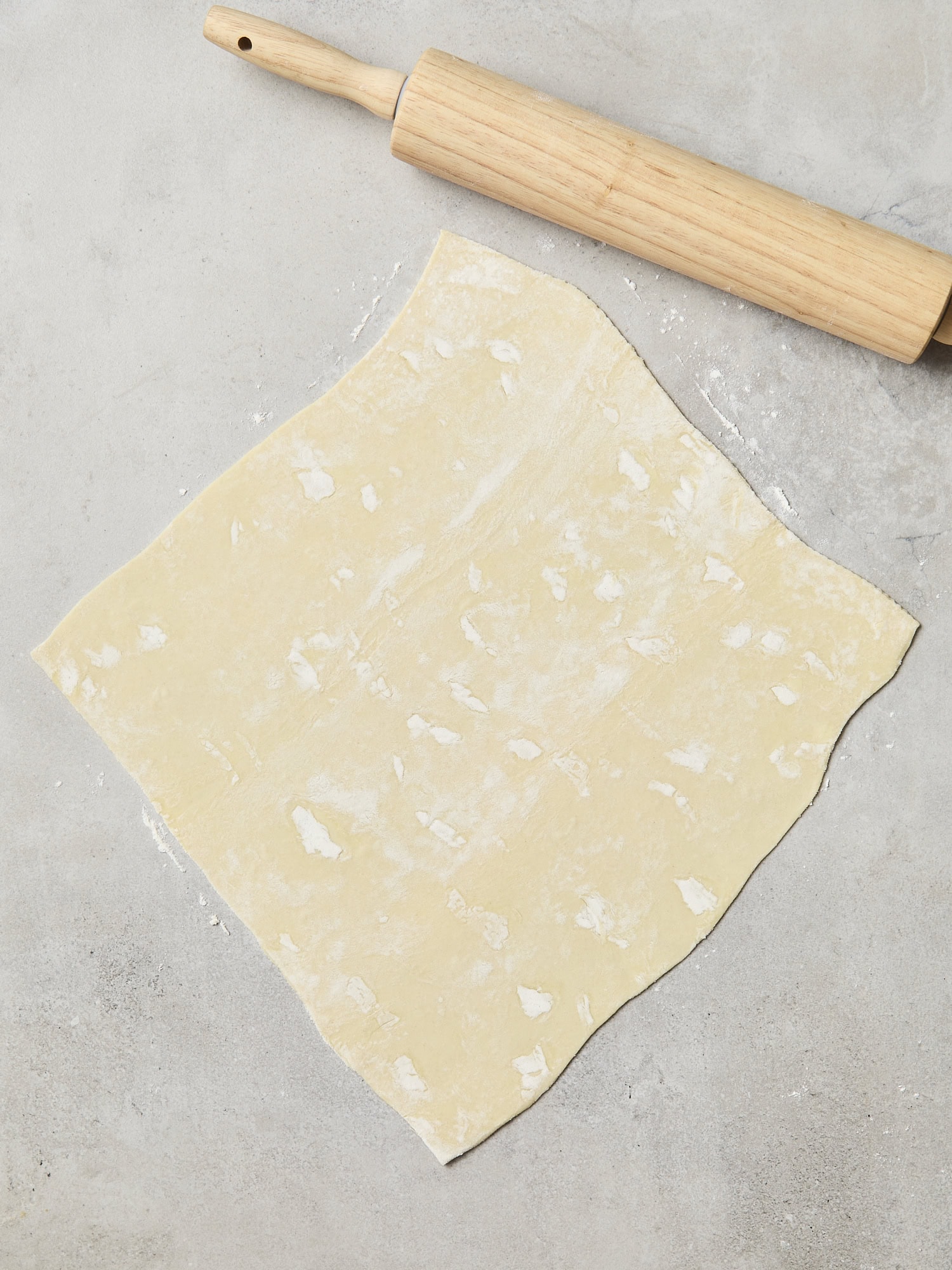 Rolled out puff pastry for quiche.