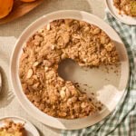 Raspberry orange coffee cake with slices removed.