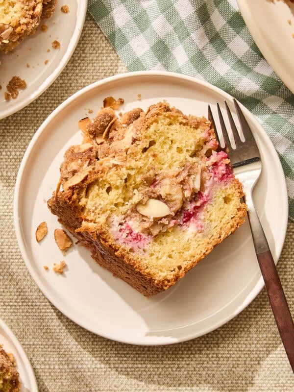 Plate with slice of raspberry orange coffee cake.