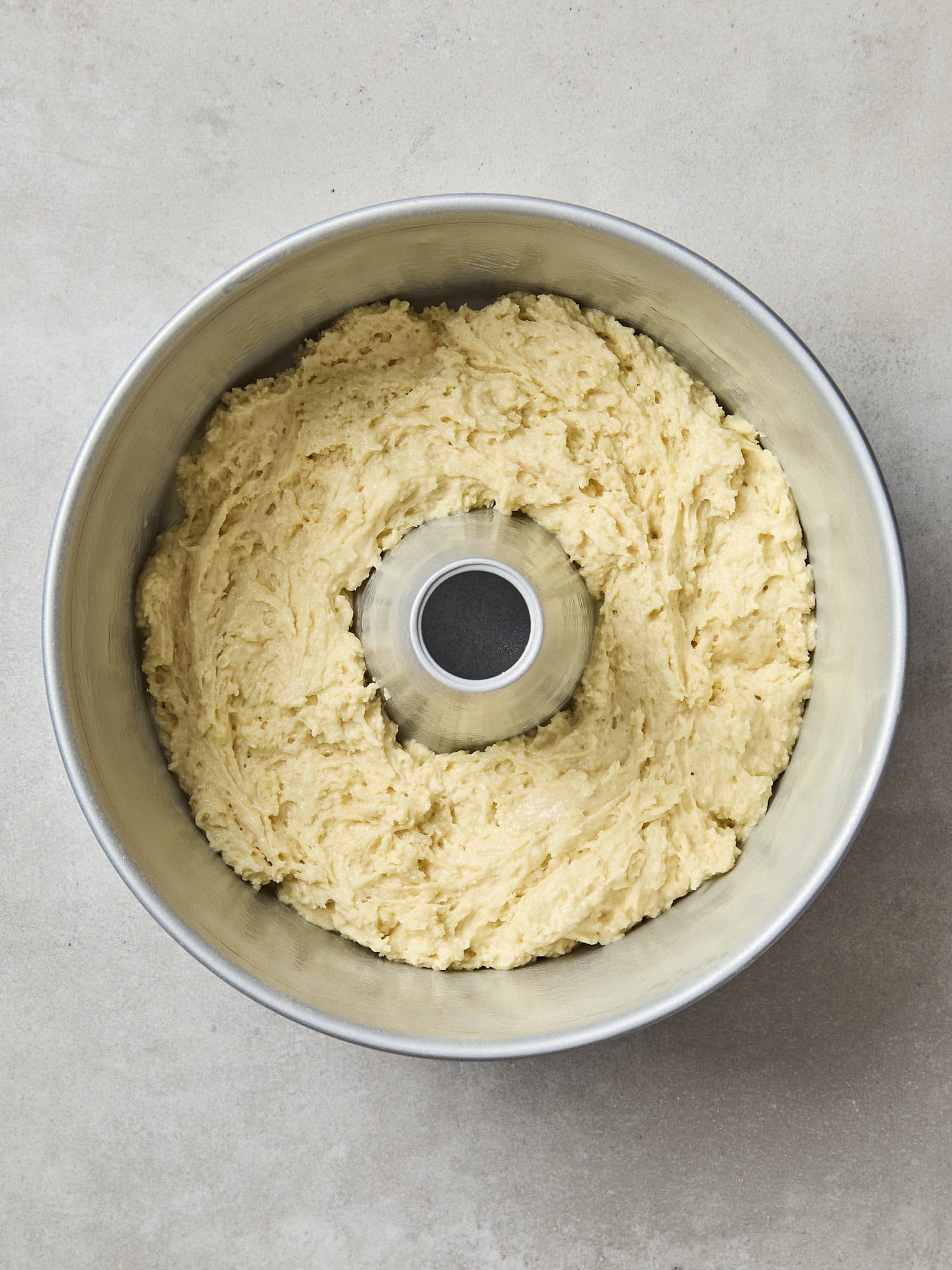 Batter in bottom of cake pan.