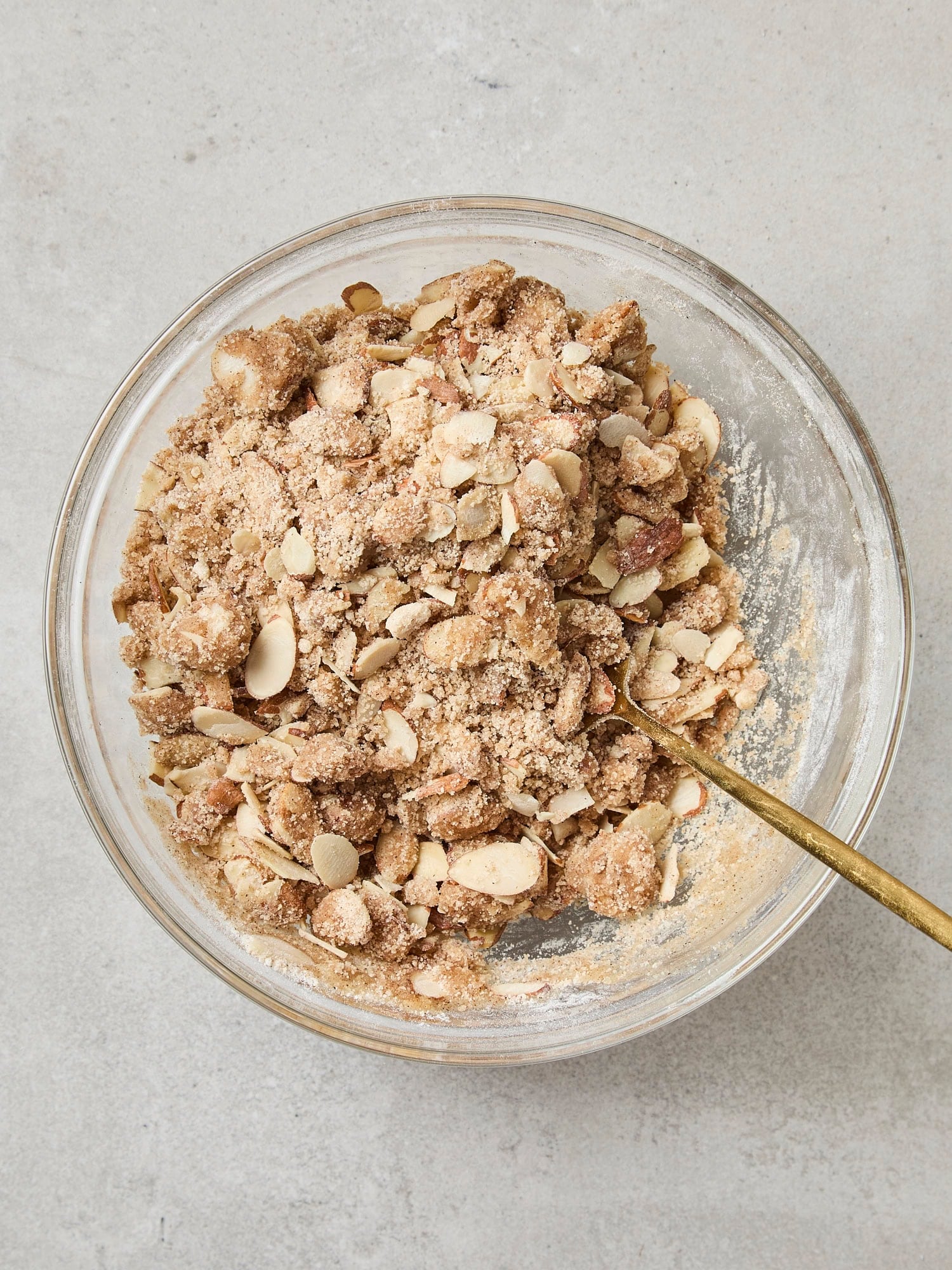 Glass bowl with mixed streusel fro coffee cake.