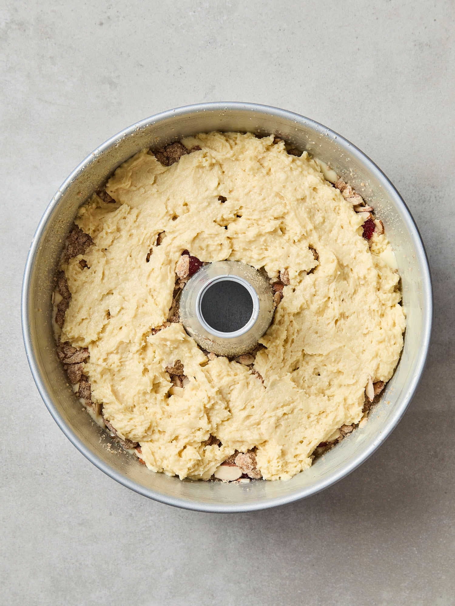 Batter spread as a layer in coffee cake.