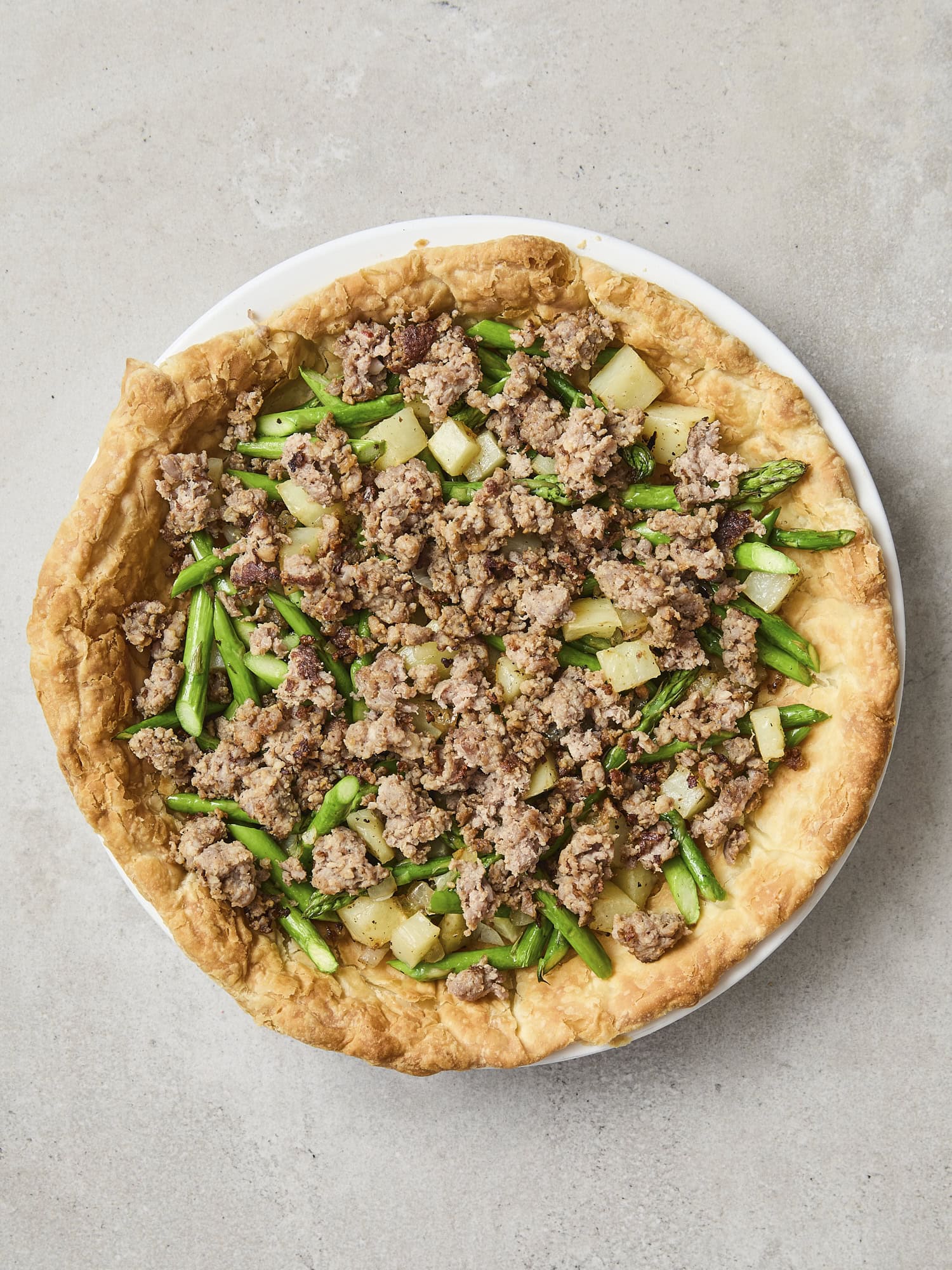 Sausage and roasted vegetables in a blind baked puff pastry crust.
