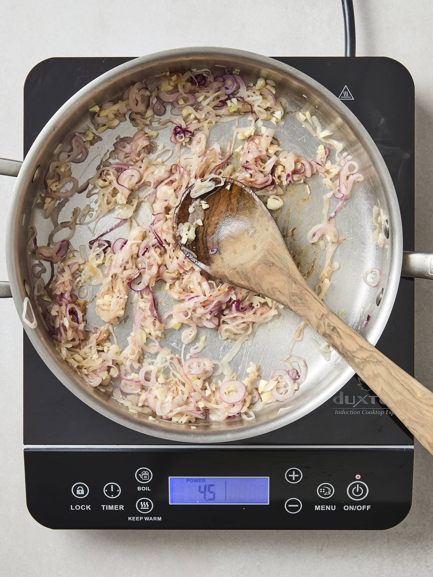 Cooking scalloped potatoes in a pan.