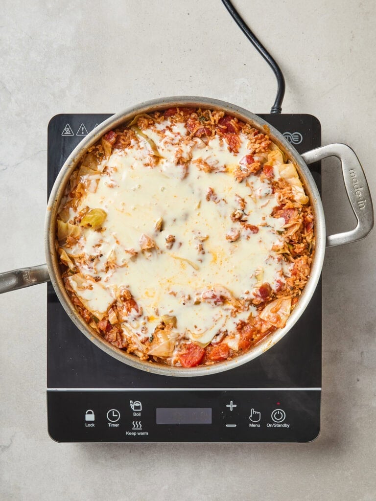 Cheese melted over a the unstuffed cabbage roll skillet.