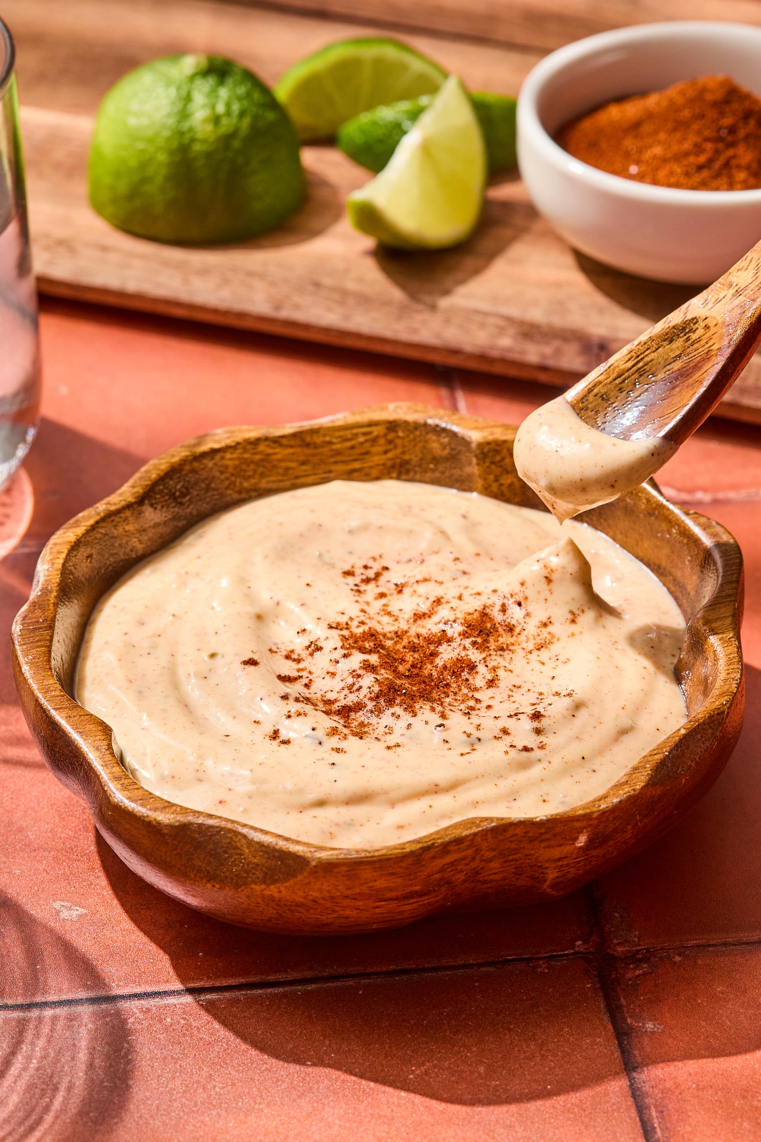 Spoon holding chipotle mayo showing texture.