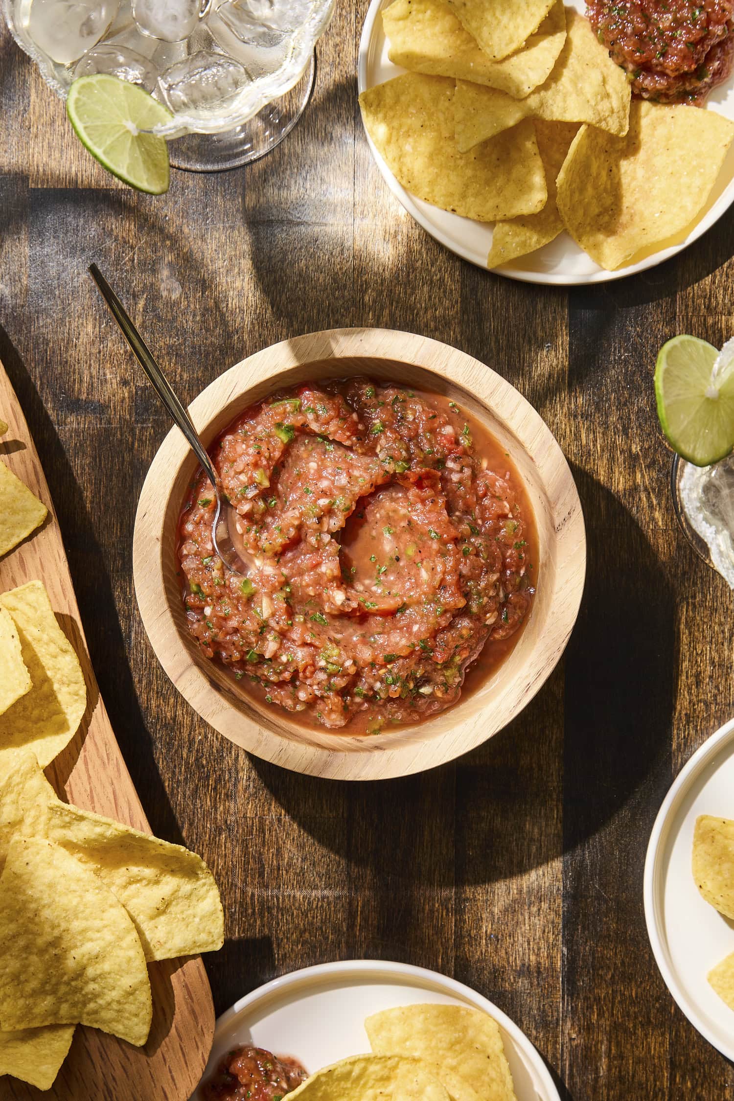 Small wooden bowl filled with restaurant-style salsa.