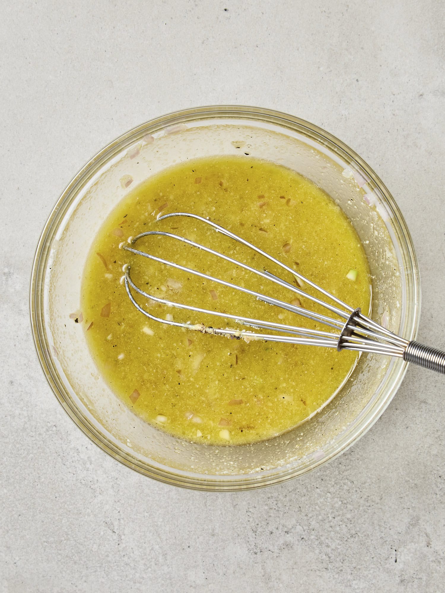 Emulsified vinaigrette salad dressing in bowl.