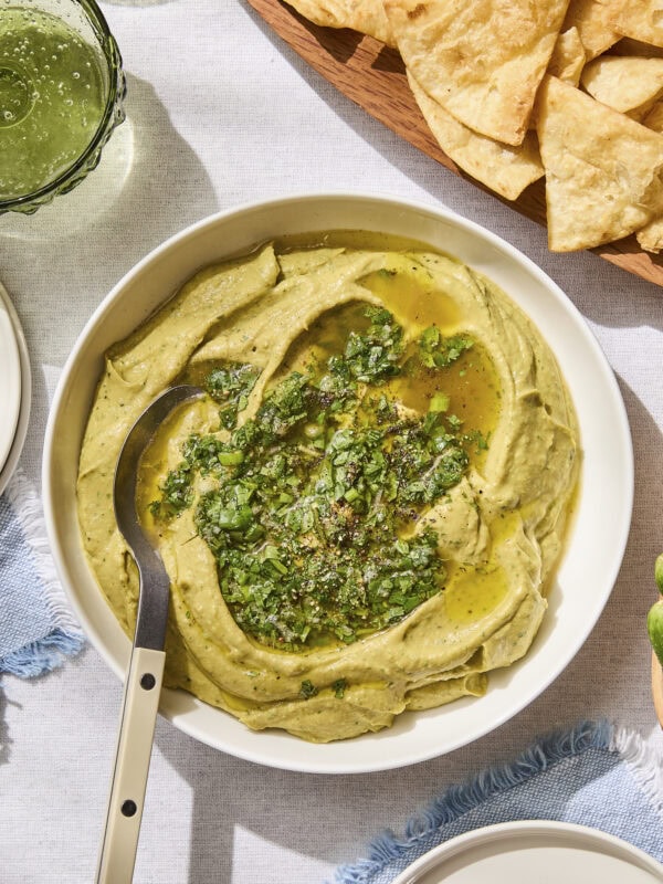 Avocado hummus topped with cilantro sauce.