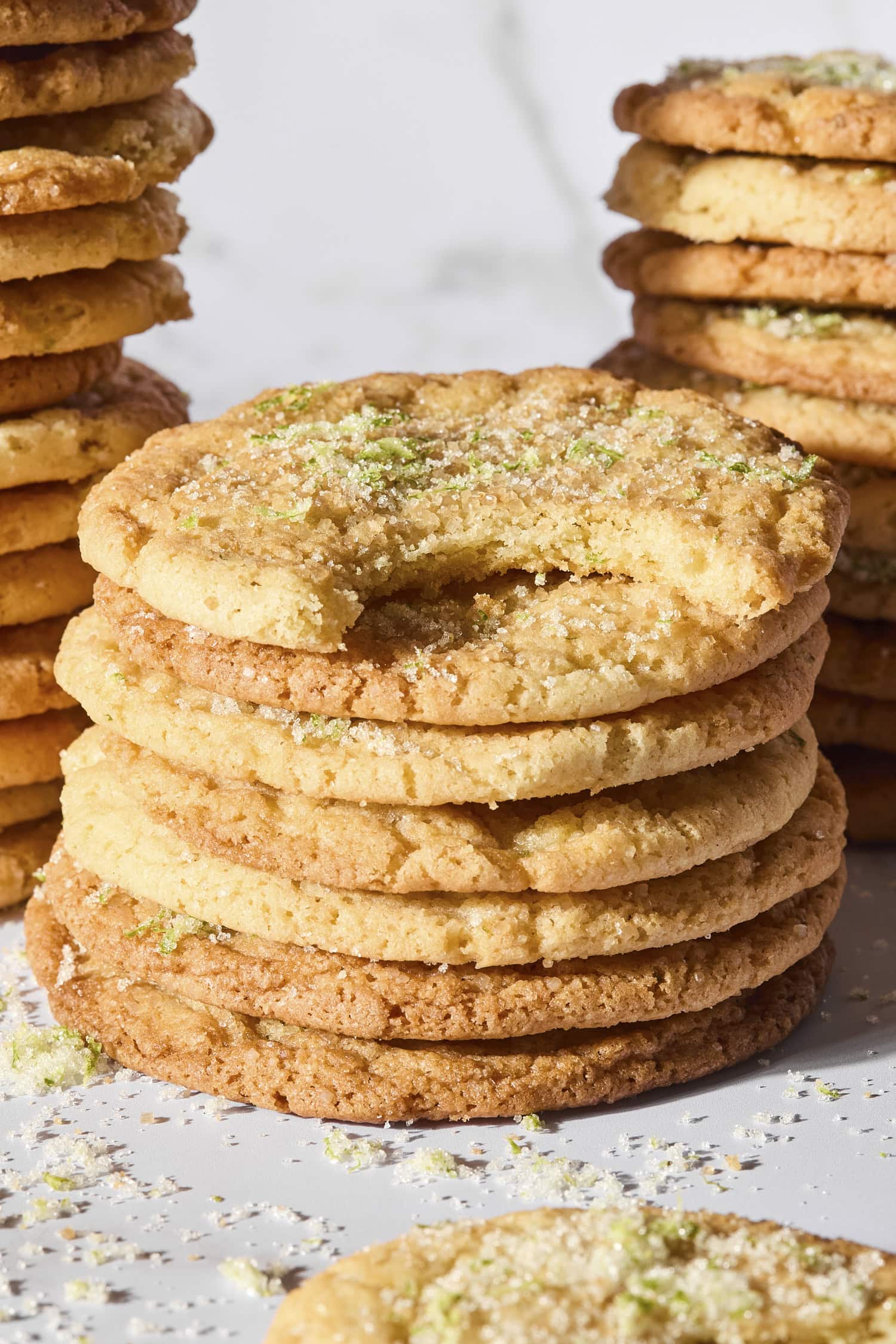 Stack of slice and bake sugar cookies with bite taken out.