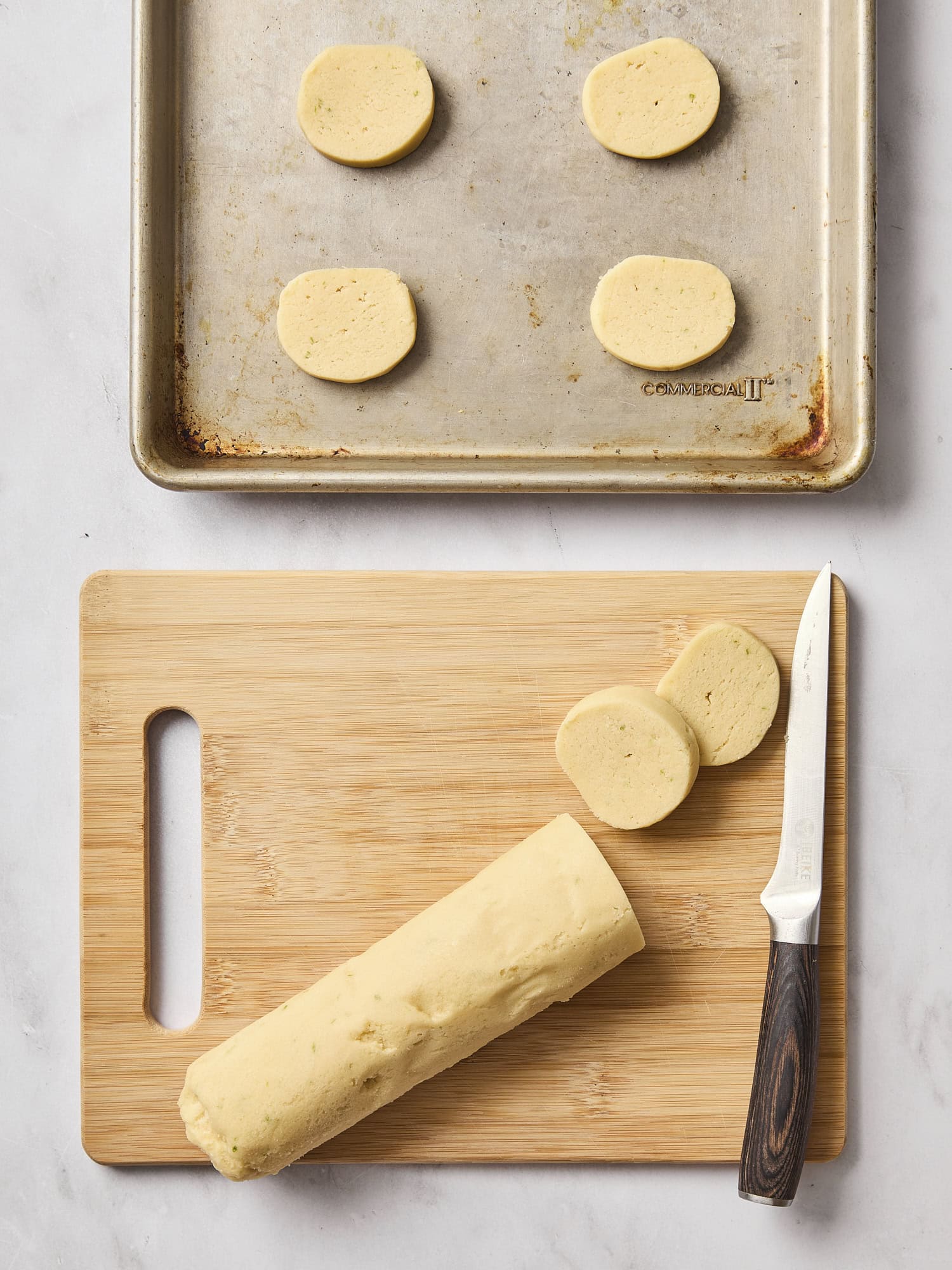 Slicing sugar cookies.