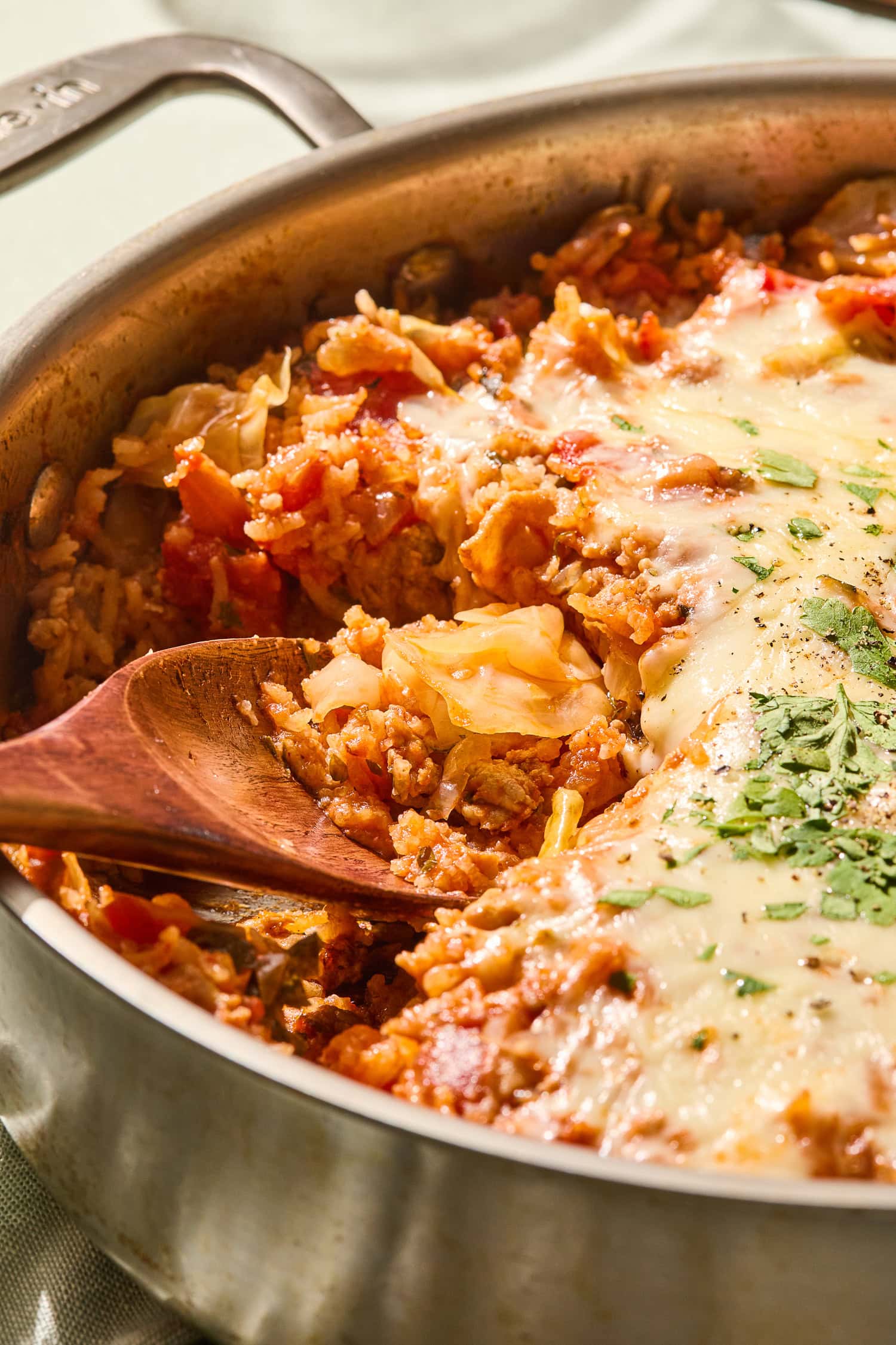 Small pieces of pork and rice in a cabbage skillet.