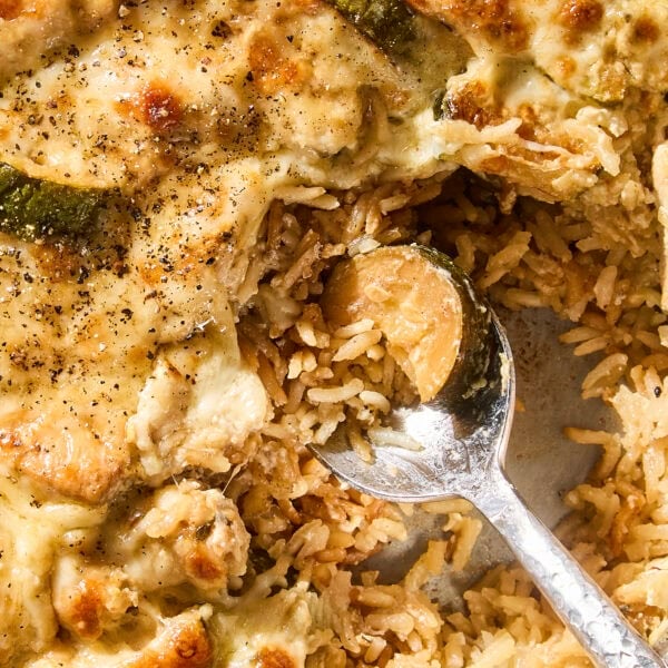 Spoonful of chicken zucchini rice casserole fresh from the oven.