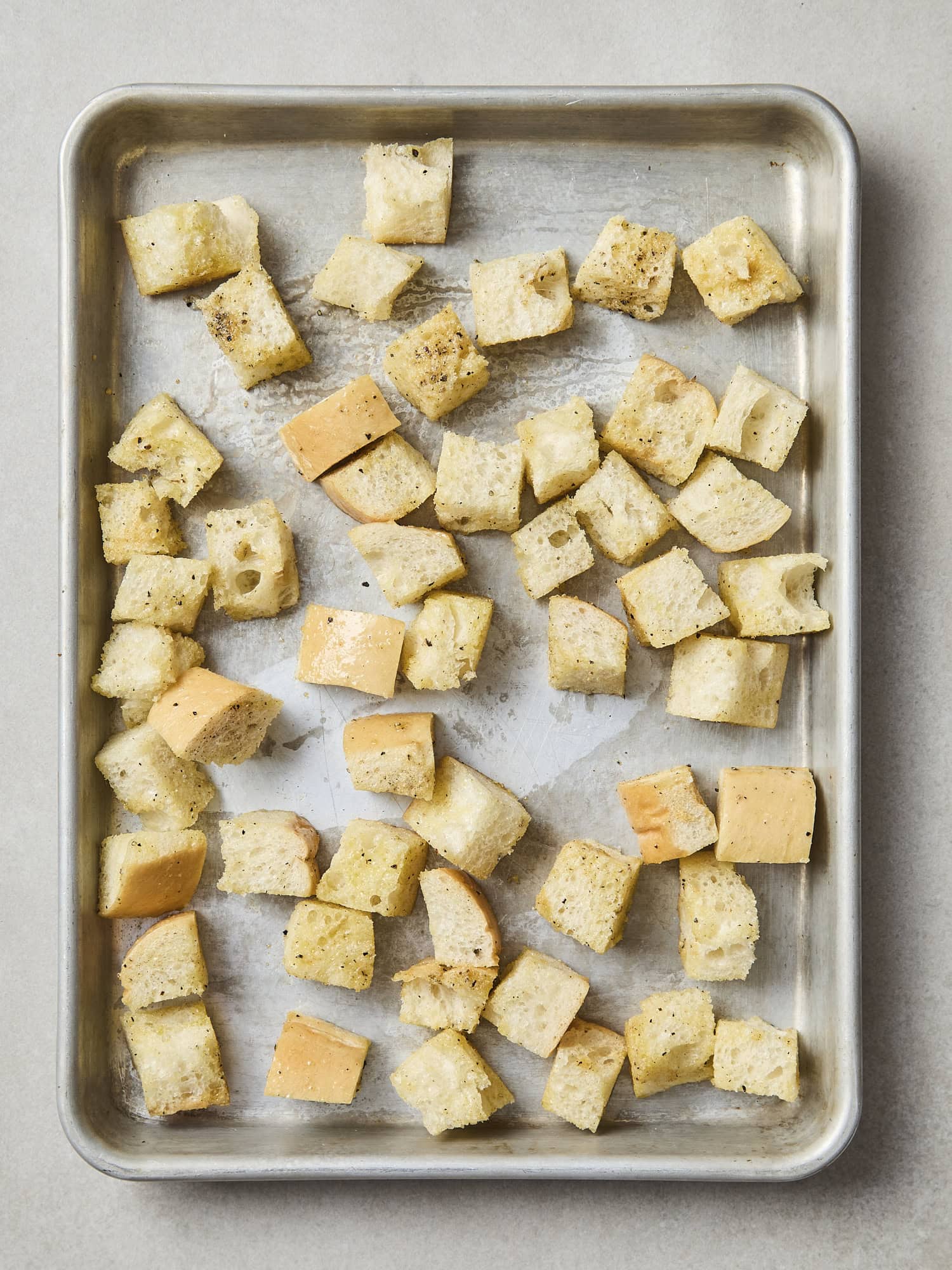 Unbaked seasoned bread cubes for croutons.