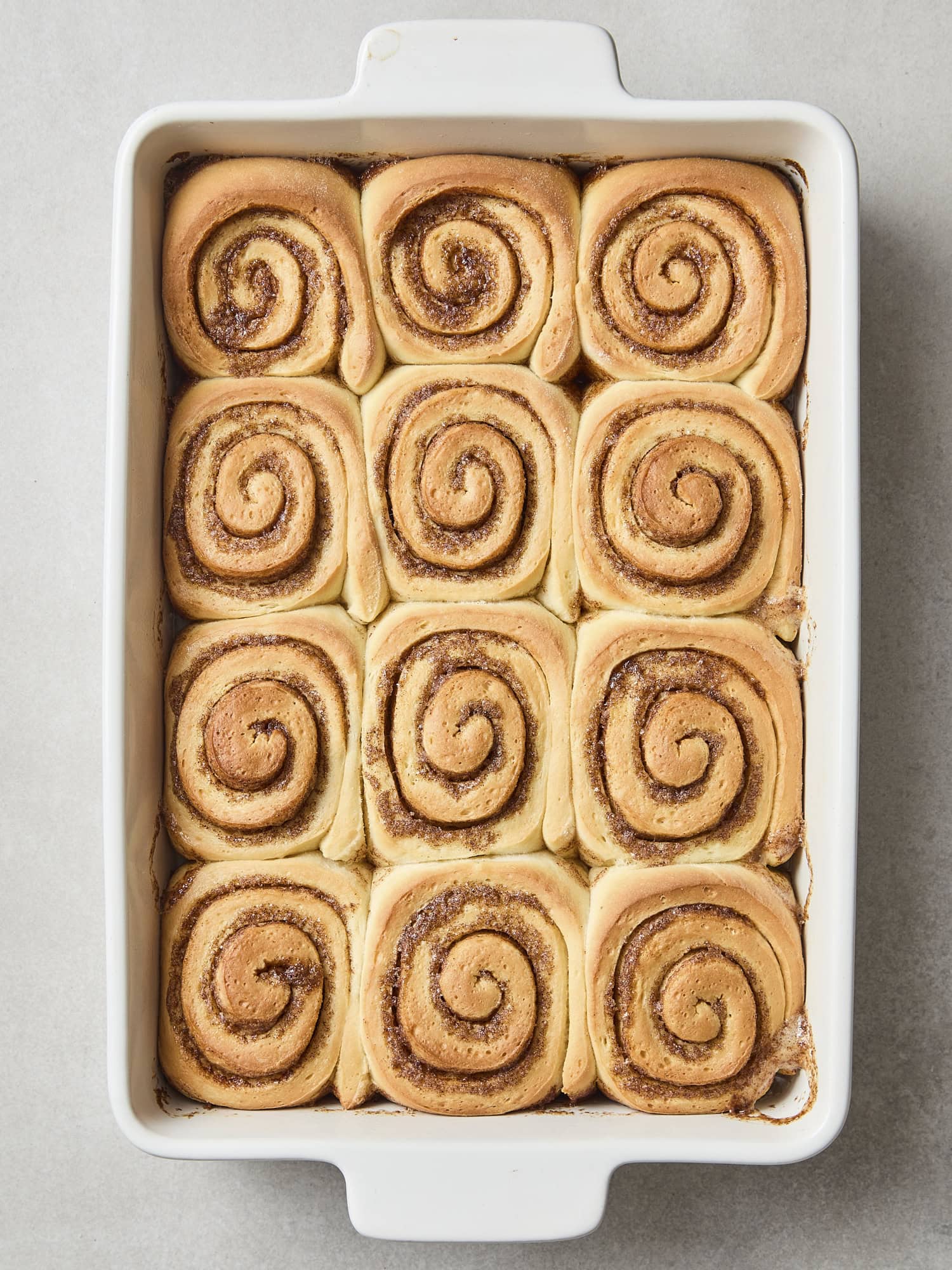 Pan of baked cinnamon rolls before icing on top.