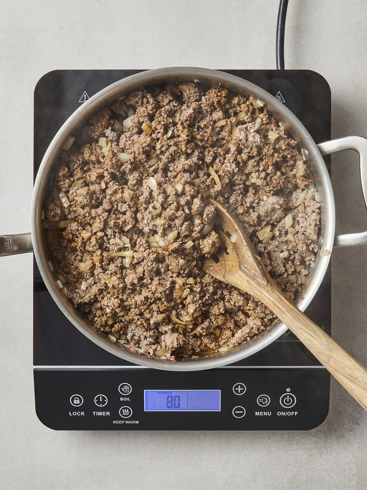 Ground beef cooked and onion.