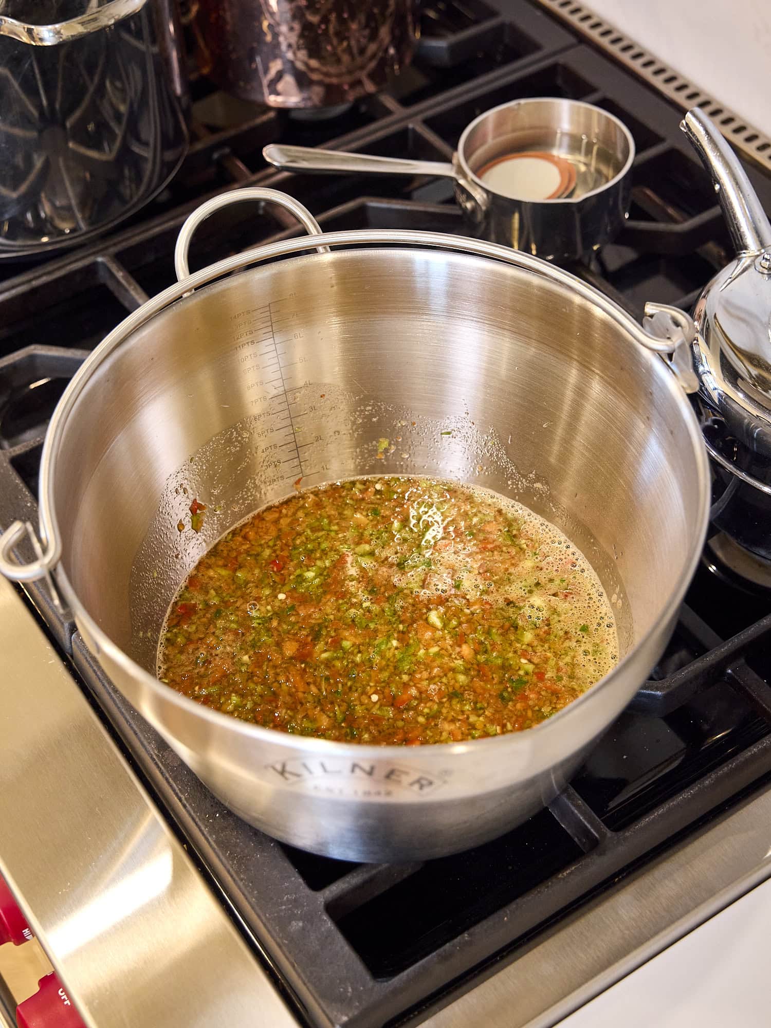 Cooking mixture of hot pepper jelly.