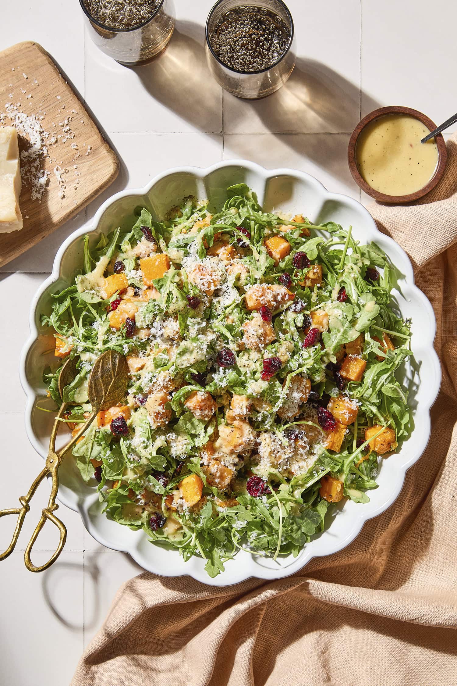 Large salad bowl with roasted butternut squash with apple cider vinaigrette.
