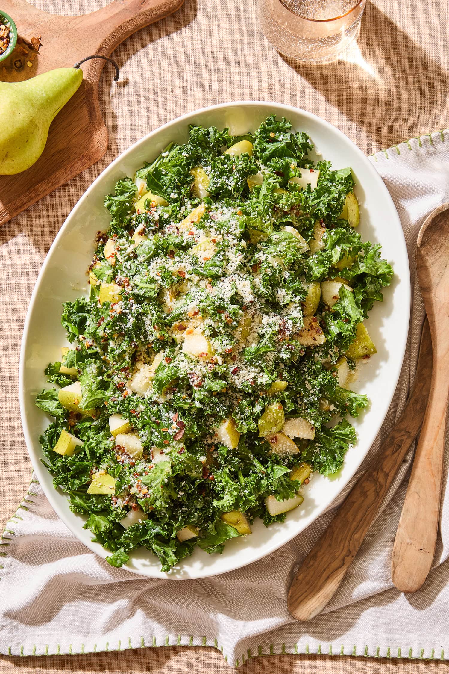 Spicy pear kale salad on a serving platter.
