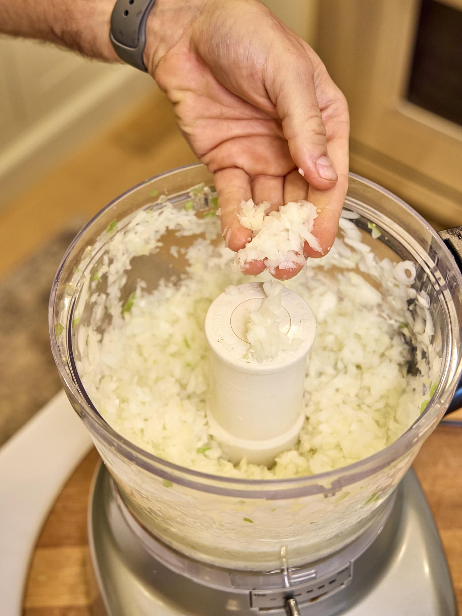Chopped onion in a food processor.