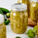 Jars of canned tomatillo salsa verde.