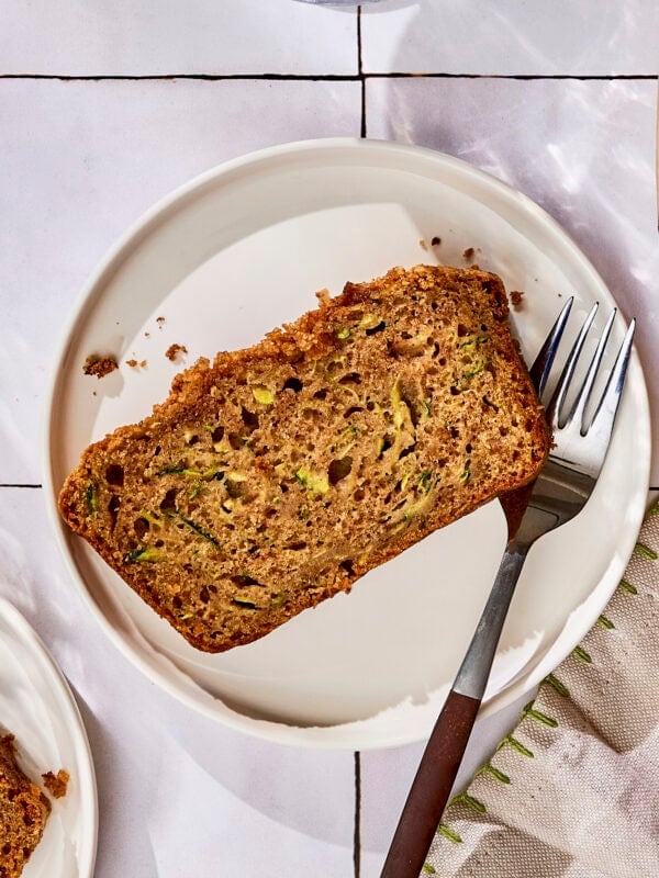Plate with slice of zucchini bread.
