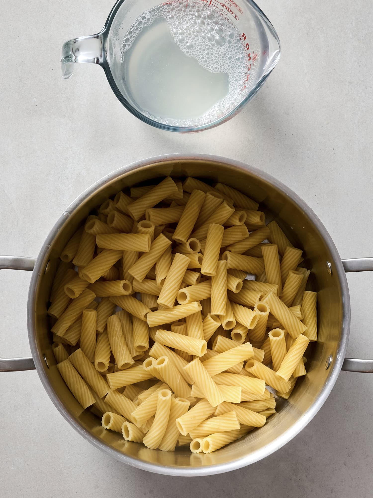 Cooked pasta and reserved pasta water.