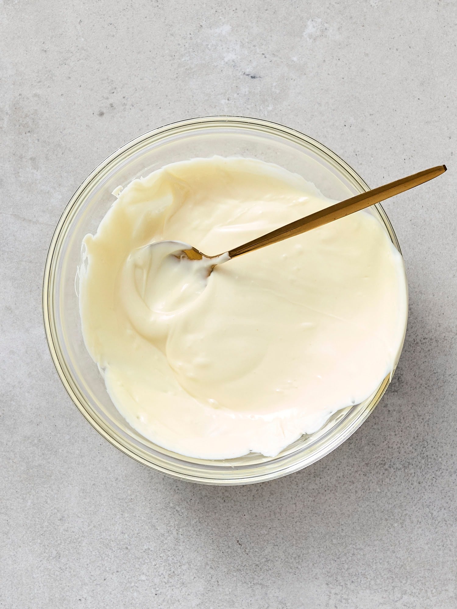 Melted white chocolate in a bowl.