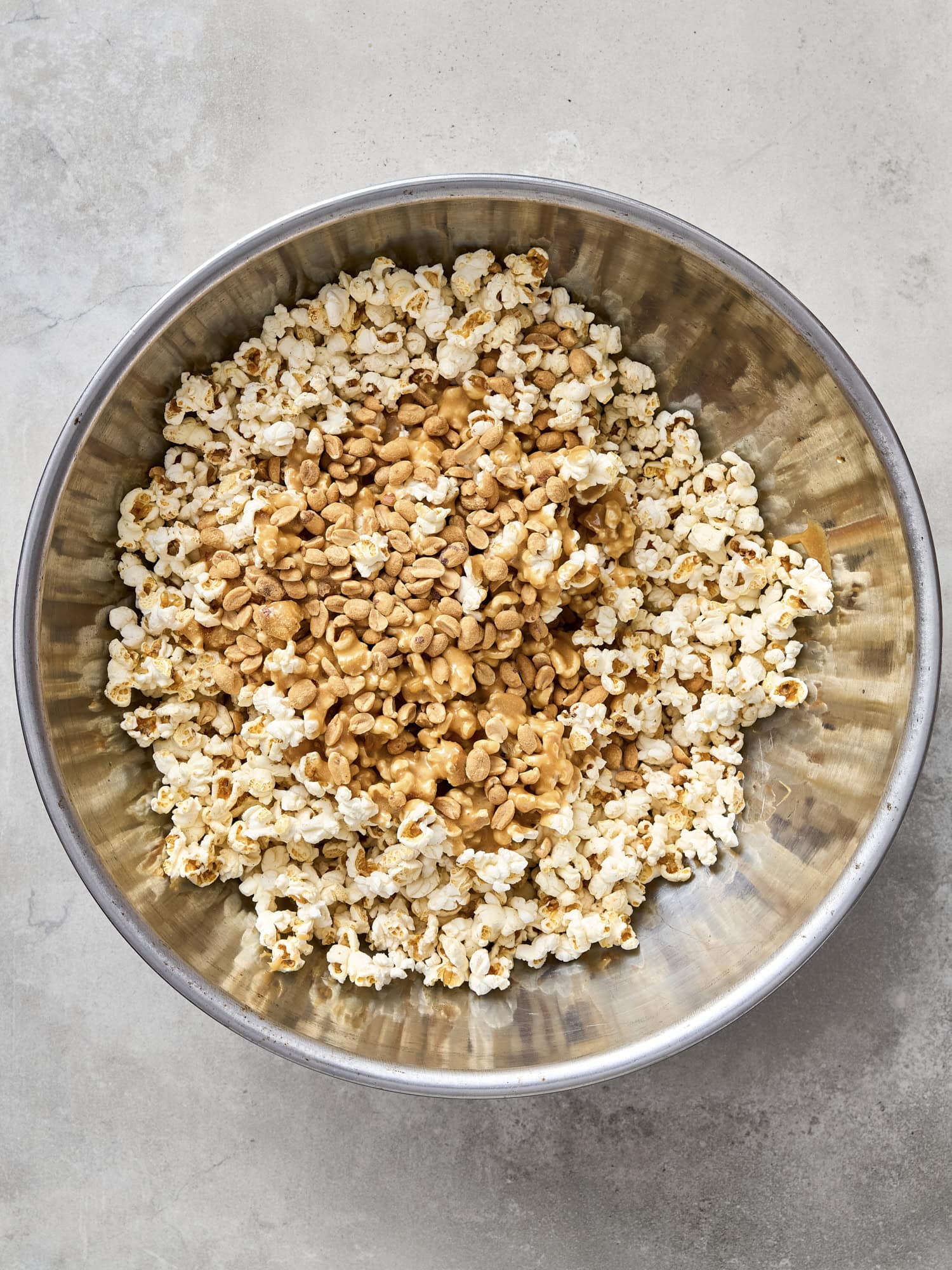 Caramel sauce on popped popcorn.