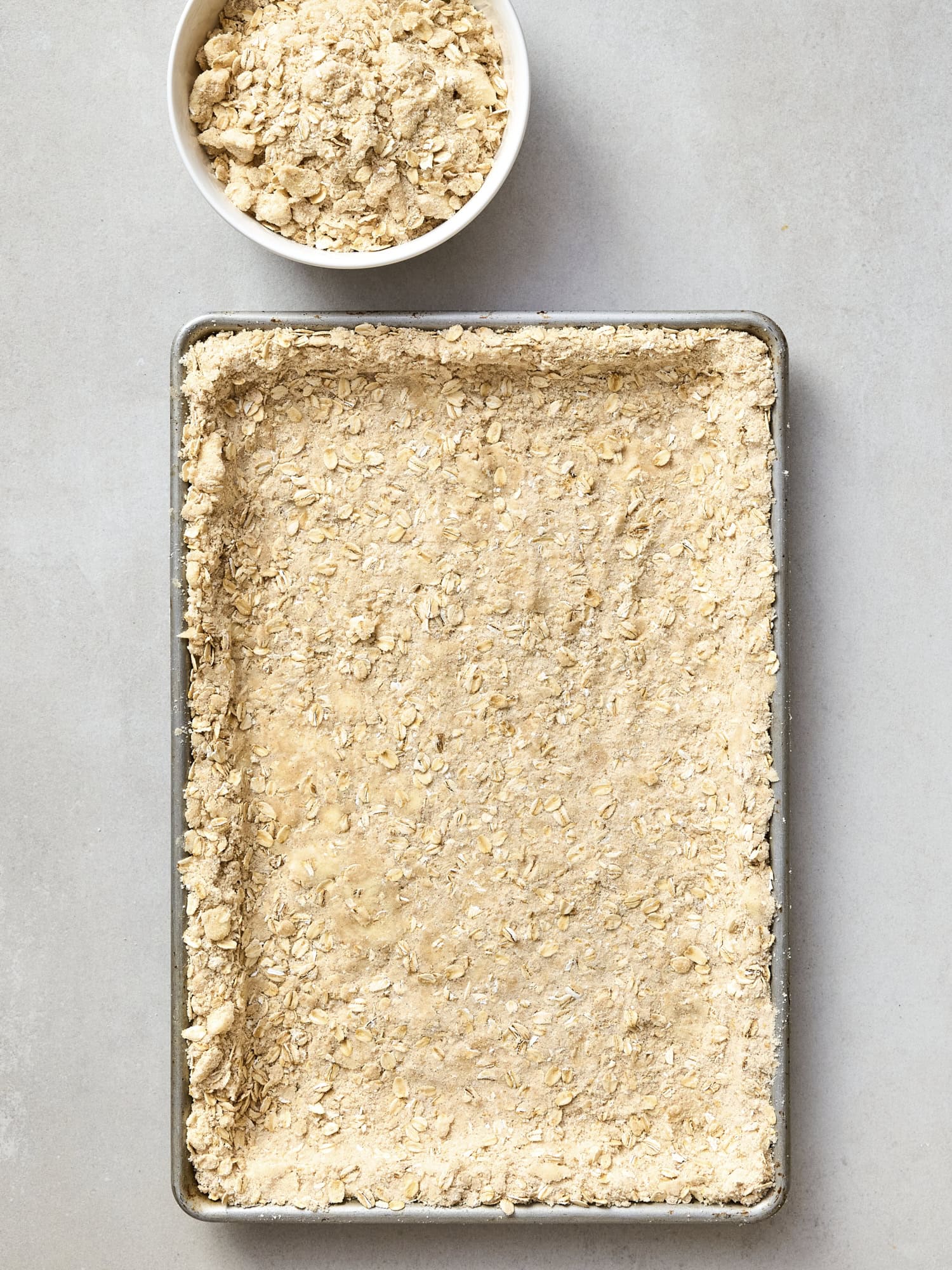 Unbaked oat filling pressed into a pan for crust.