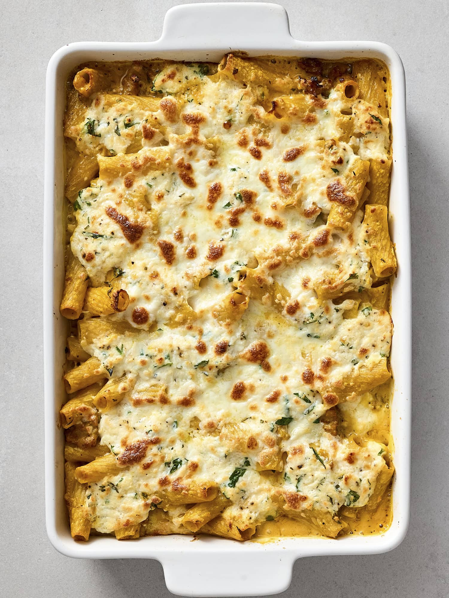 Baked pumpkin baked ziti with cheesy topping.