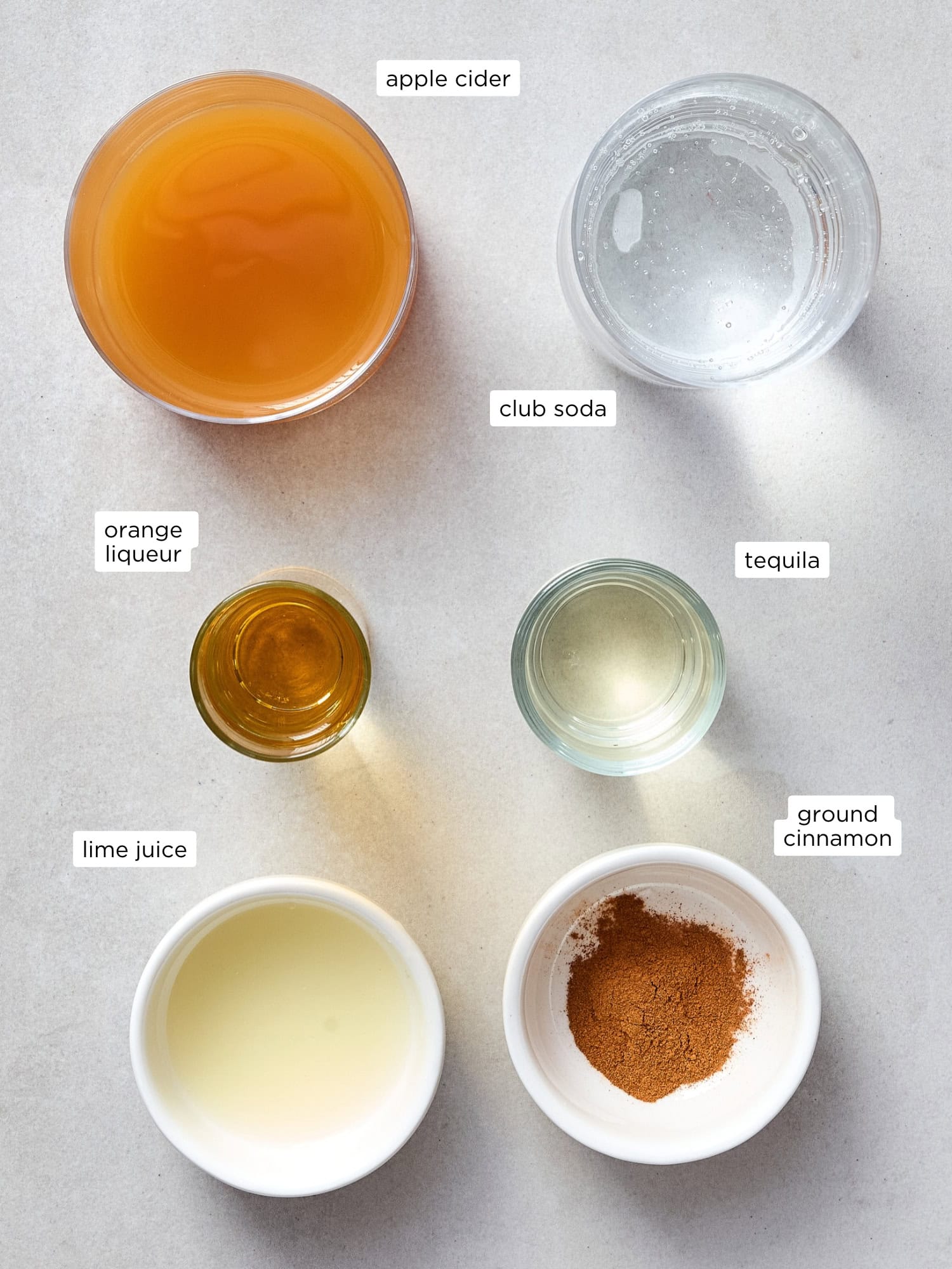 Ingredients needed for an apple cider margarita recipe.