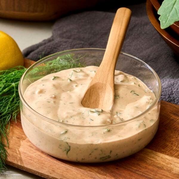Glass bowl with BBQ ranch dressing.