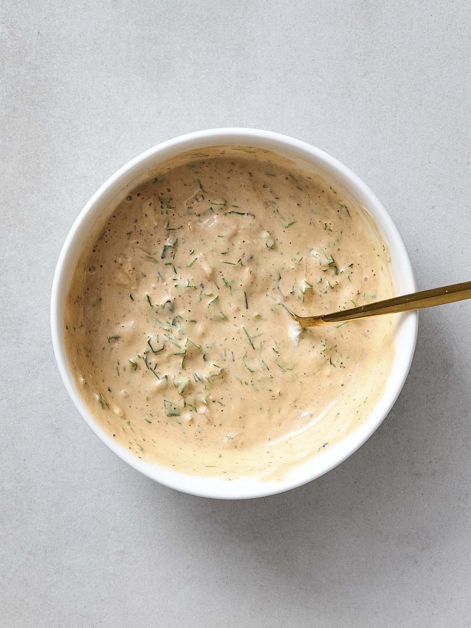 All ingredients mixed together in a bowl for BBQ ranch dressing.