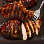 Sliced BBQ chicken breast after coming off the grill.