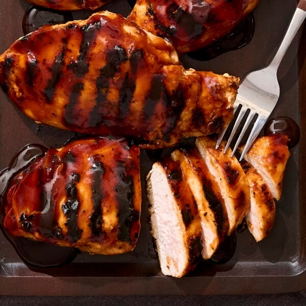 Sliced BBQ chicken breast after coming off the grill.