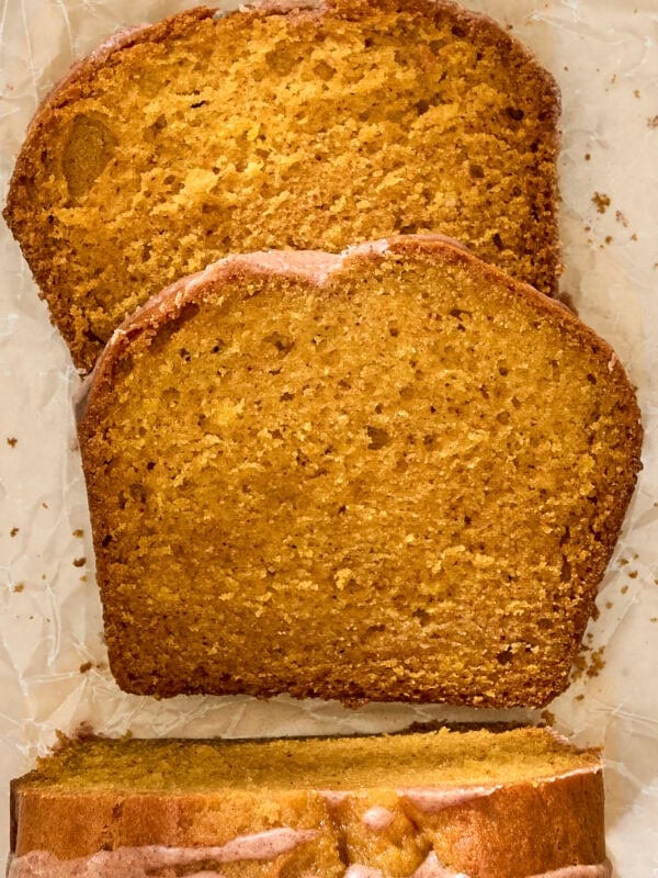 Two slices of pumpkin bread sliced.