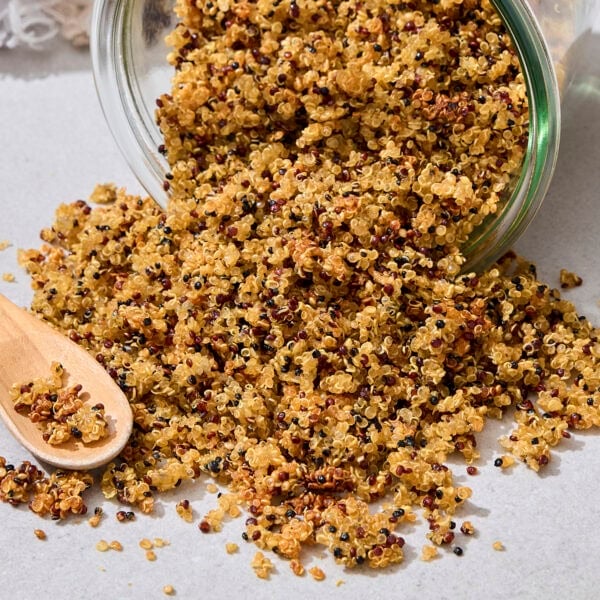 Jar filled with cooked crispy quinoa recipe.