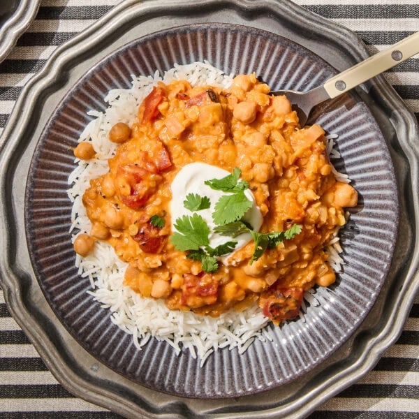 Lentil and chickpea curry with rice on a plate.